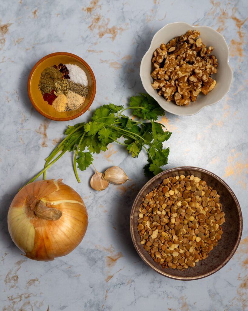 Ingredients for the vegan sausage crumble: spices, walnuts, lentils, onion, garlic, parsley.