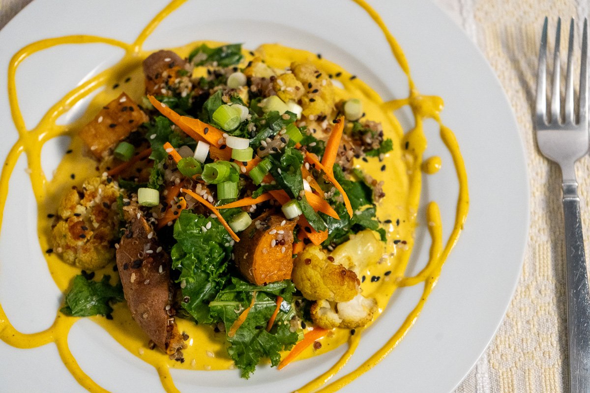 Close up of kale salad on a white plate