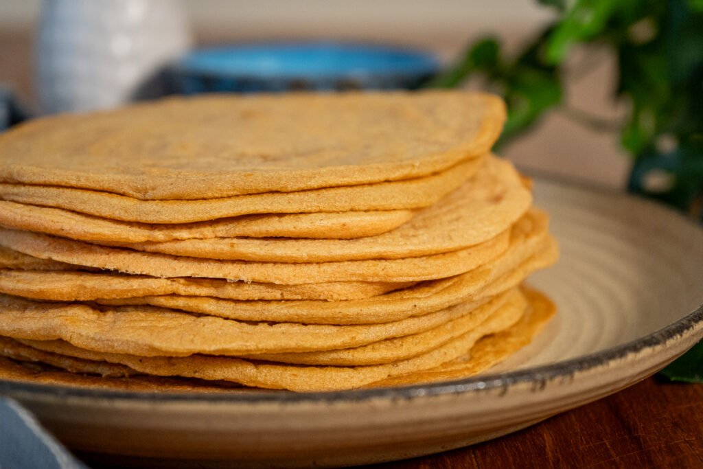 Close up of a stack of lentil wraps from the side.