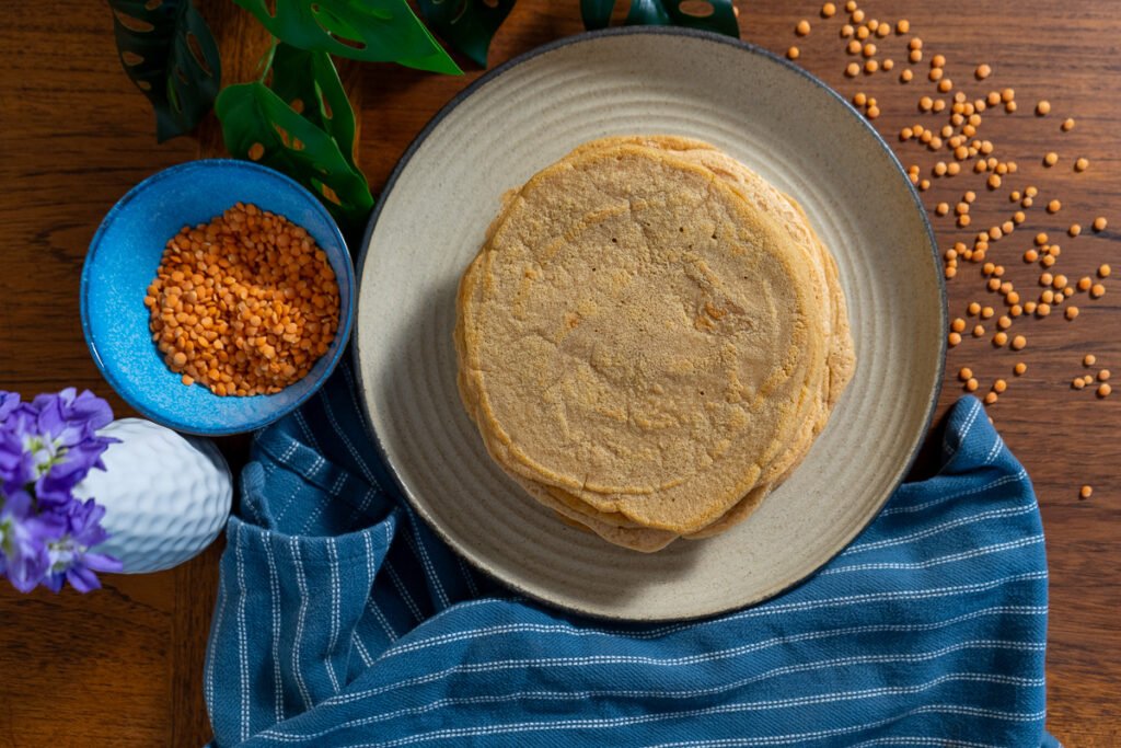 Looking straight down at a stack of red lentils.