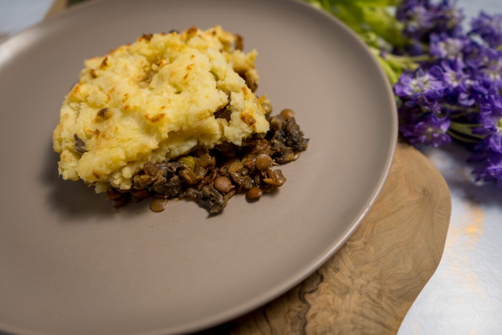 A slice of shepherd's pie on a plate